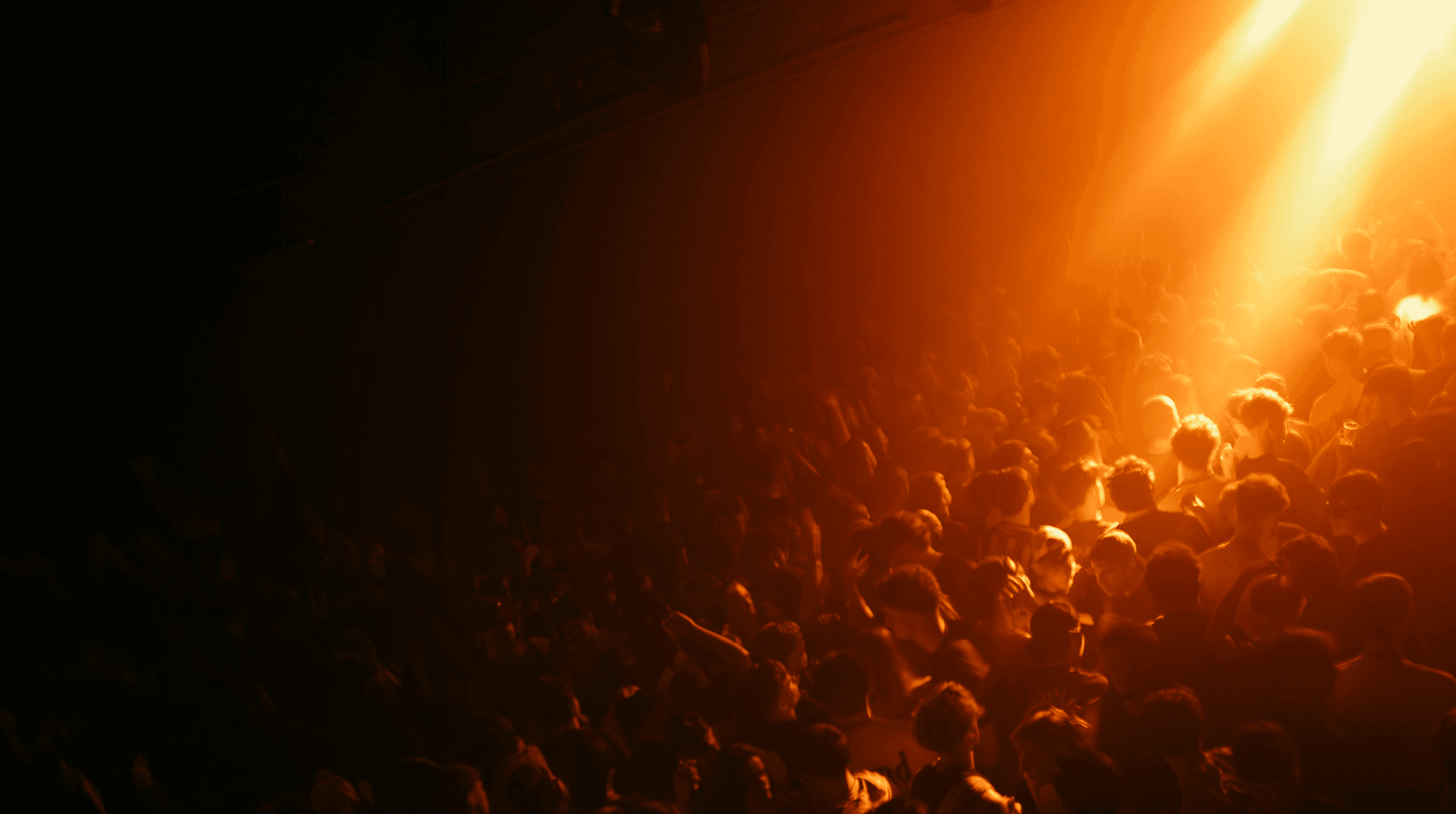 Wide view of the crowd and lighting inside Amber's.